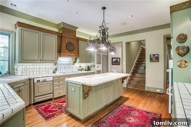 Bluffview's Private 2-Acre Urban Sanctuary 15 French country-style kitchen with high-end appliances and stunning views of the lush estate