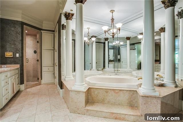 Bluffview's Private 2-Acre Urban Sanctuary 20 Spa-like master bathroom featuring a dramatic jetted tub, dual vanities, and a spacious walk-in shower