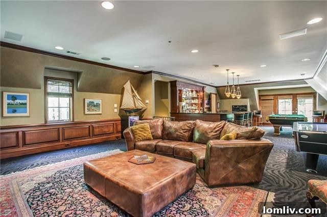 Bluffview's Private 2-Acre Urban Sanctuary 22 Vibrant upstairs game room with space for a pool table and lounge, opening to a second-floor outdoor terrace