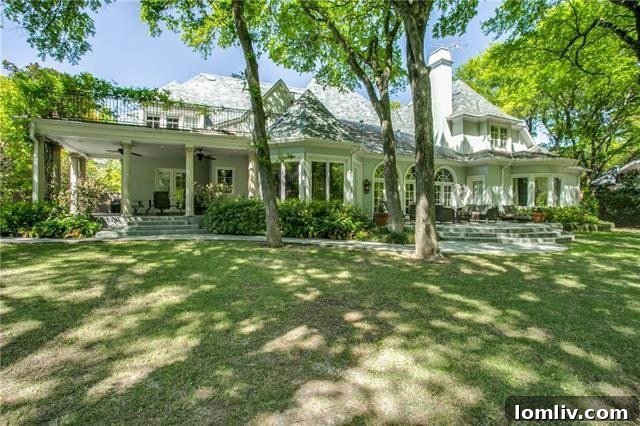 Bluffview's Private 2-Acre Urban Sanctuary 5 Covered and open back patios on both levels of the luxury Bluffview home, perfect for outdoor living