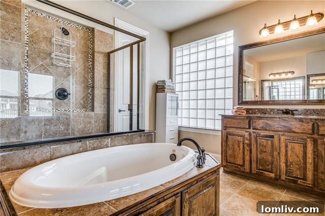 Stylish dual vanities in the master bathroom, offering plenty of space and storage.