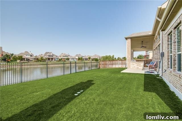The back exterior of the home, showcasing the covered patio and the stunning canal views.