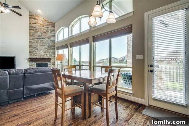 Spacious living area bathed in natural light, featuring elegant hardwood floors and a welcoming ambiance.