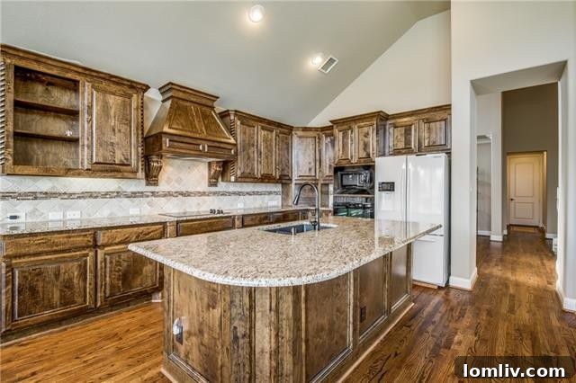 Open-concept kitchen with high-end appliances, custom cabinetry, and ample counter space, perfect for culinary enthusiasts.