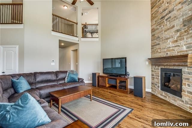 Detail shot of the impressive stone fireplace, adding character and warmth to the living space.
