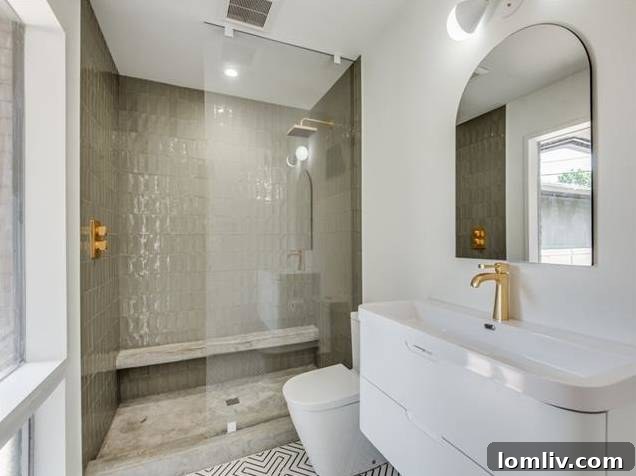 Master Bath with Brushed Brass Hardware and Concrete Tile