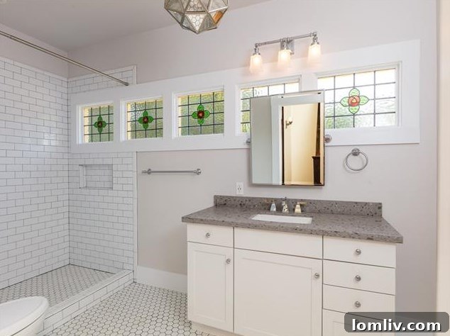 Hemphill Heights Classic: Craftsman Home with Untapped Potential on Travis Avenue 11 Bright and spacious bedroom with hardwood floors and renovated details, offering comfort and style