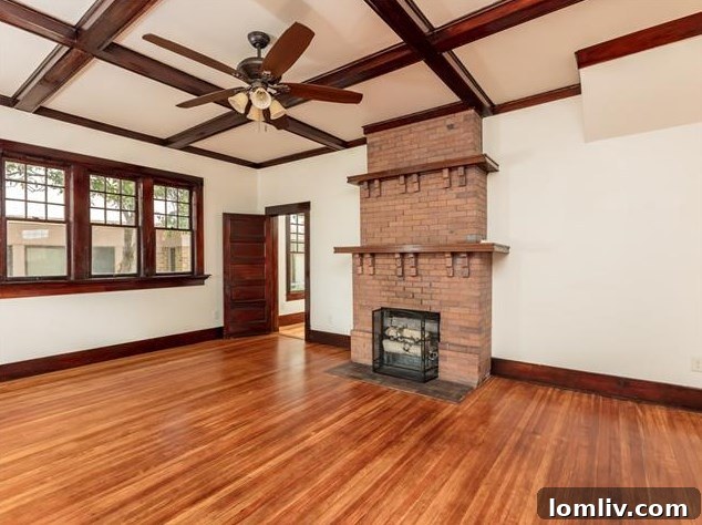 Hemphill Heights Classic: Craftsman Home with Untapped Potential on Travis Avenue 3 Elegant living room with a tiered brick fireplace and coffered ceiling at 2832 Travis Avenue
