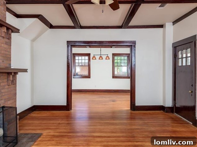 Hemphill Heights Classic: Craftsman Home with Untapped Potential on Travis Avenue 5 Interior view showcasing the open flow and abundant natural light in the renovated Craftsman home