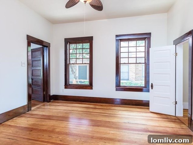 Hemphill Heights Classic: Craftsman Home with Untapped Potential on Travis Avenue 10 Upstairs landing leading to bedrooms, showcasing impeccable workmanship and natural light