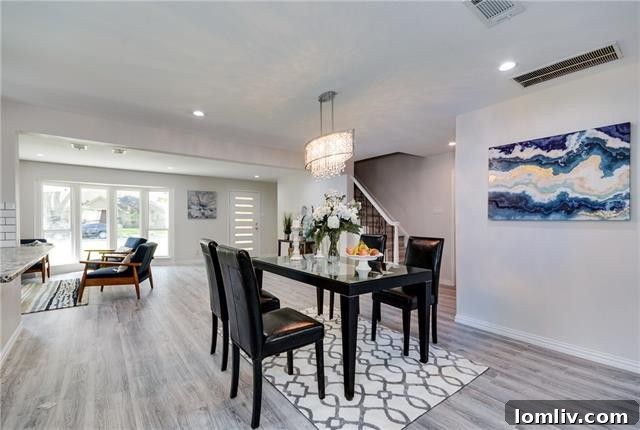 Another angle of the modern kitchen, showcasing its integration with the dining area.
