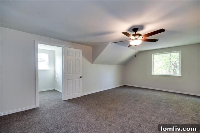 The third comfortable bedroom, featuring ample natural light and clean lines.