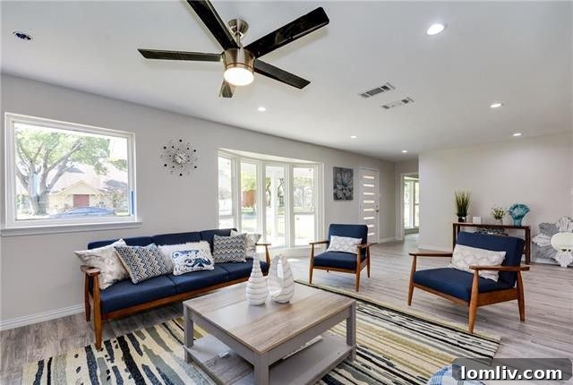 A view of one of the elegant living spaces, featuring gleaming hardwood floors and abundant natural light.