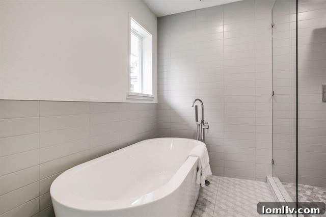 Luxurious master bathroom with soaking tub and rain shower