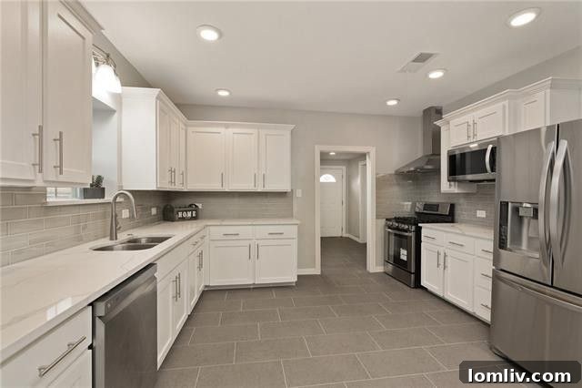 Modern kitchen with quartz countertops and custom Shaker cabinets