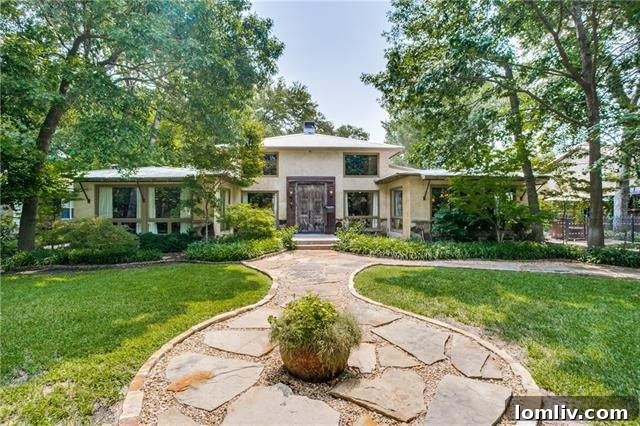 Entrance to the unique Forest Hills home, 8238 Forest Hills Blvd, showing expansive design