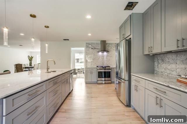 Gourmet kitchen with marble countertops and stainless steel appliances