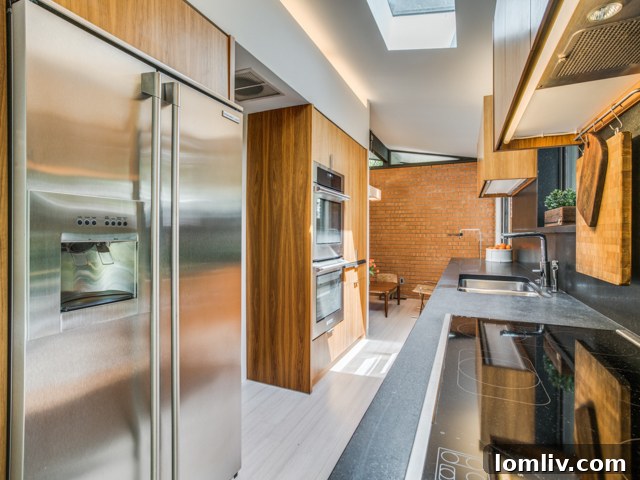 Detailed view of kitchen cabinetry and dark countertops