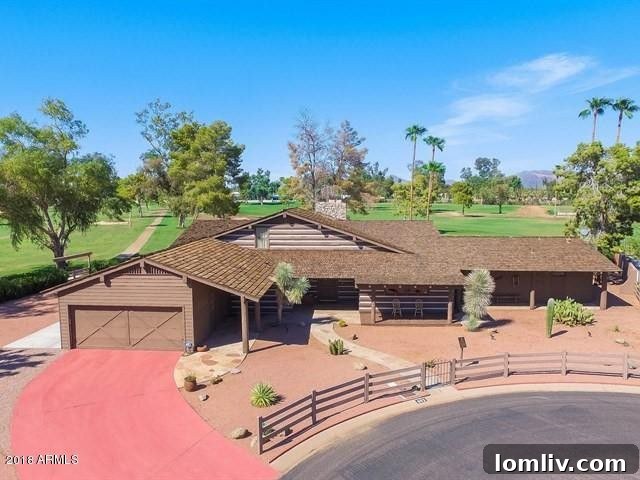 Cozy bedroom in Ponderosa II, showcasing a comfortable bed and natural light, in line with ranch-style comfort.