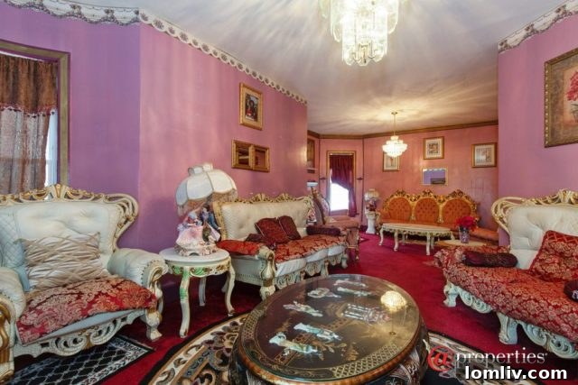 A bedroom saturated in pink with various decorative items, creating a cozy yet ornate space
