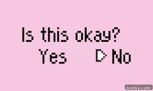 Close-up of the distinctive pink facade and front entrance of the Victorian home