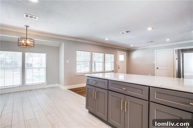 View of Living Room with Refinished Hardwood Floors and Recessed Lighting