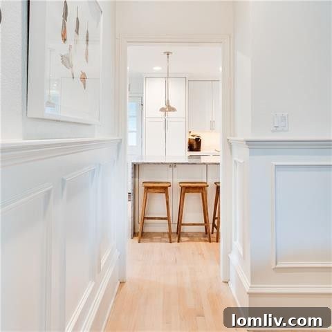 Modern kitchen backsplash with unique texture and white cabinetry