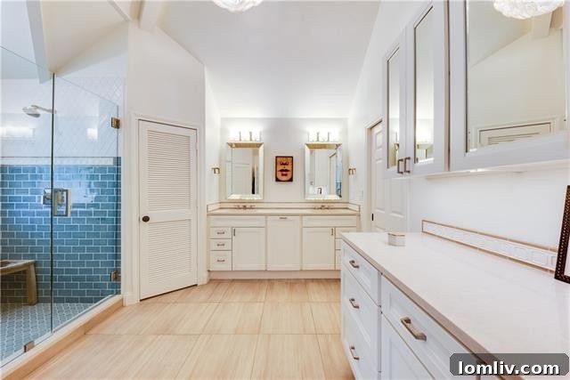 Luxurious walk-in shower with blue tiles and arched window