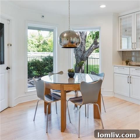 Wide shot of the renovated kitchen with a striking blue island in Dallas modern farmhouse
