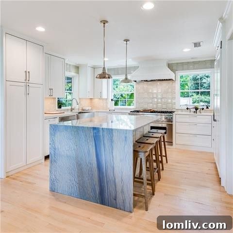 Detailed view of the kitchen, highlighting the stunning blue island and modern appliances
