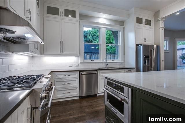 The luxurious chef's kitchen with quartz countertops and custom cabinetry