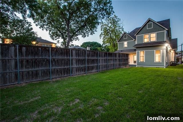 A serene back porch overlooking a spacious yard with pool potential
