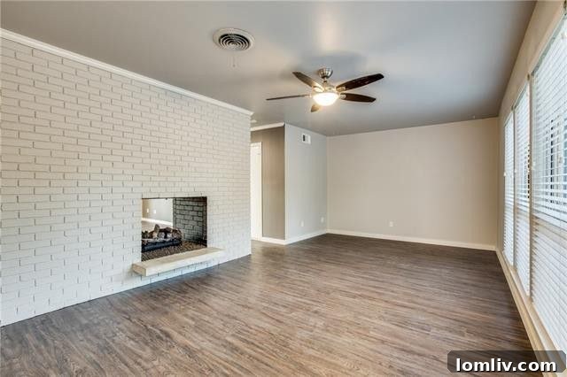 A pristine, newly renovated kitchen with granite countertops, stainless steel appliances, and modern cabinetry.