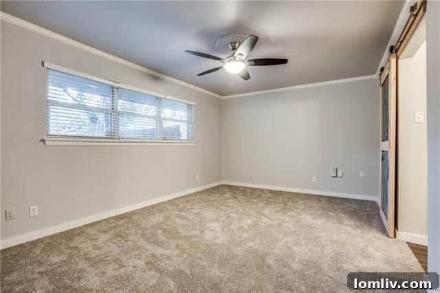 Close-up of the double-sided fireplace, showcasing its modern facade and connecting two living spaces.