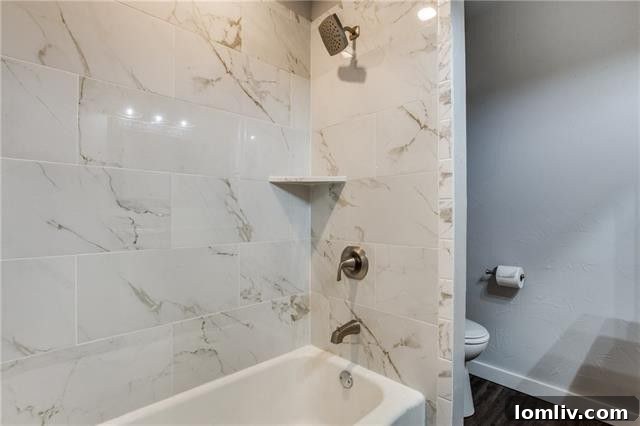 Another bedroom, showcasing the fresh paint and comfortable new carpet.