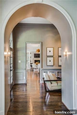 Elegant chandelier illuminating a high-ceilinged room, adding a touch of grandeur