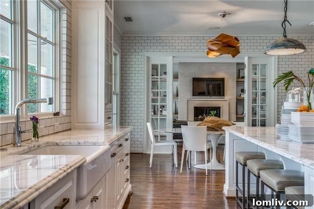 Bright kitchen area with views of the backyard through French doors
