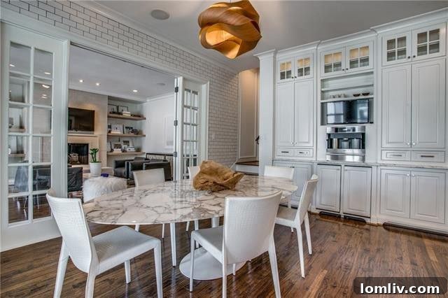View of the expansive family room, connected to the kitchen by French doors