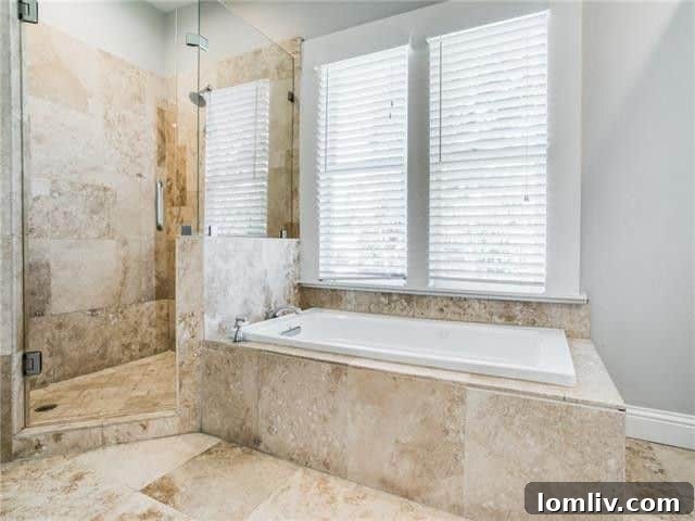 Another beautifully appointed bedroom, highlighting the home's generous proportions.