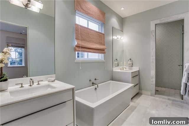 A view of the separate, deep soaking tub in the master bathroom, ideal for relaxation.