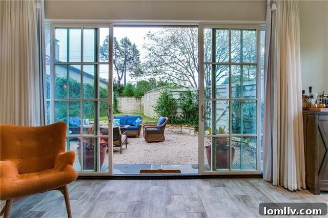 Exterior view of the home from the landscaped garden, showcasing its elegant architecture.