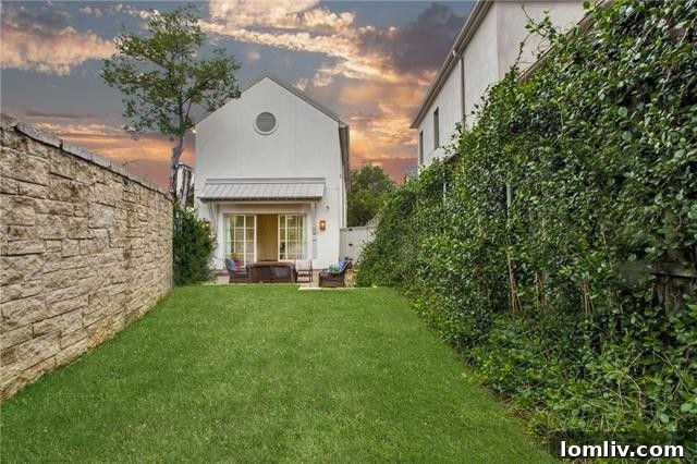 Another view of the beautifully maintained outdoor spaces surrounding the Kessler Reserve home.