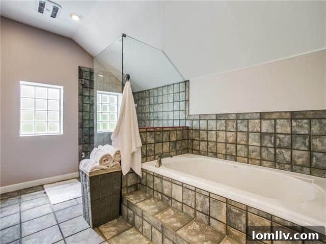 Modern and clean secondary bathroom in the Stevens Park Tudor home.