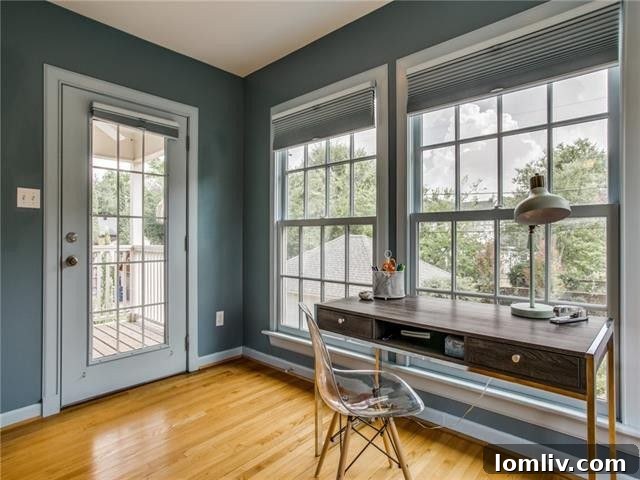 The impressive master suite with a home office area overlooking the lush grounds.