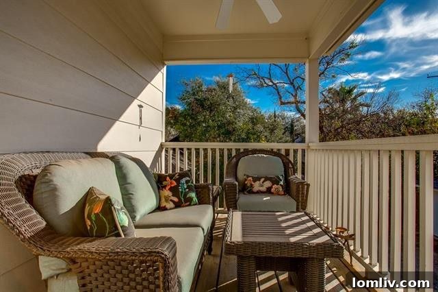 Private balcony off an upstairs bedroom, offering serene views of the neighborhood.
