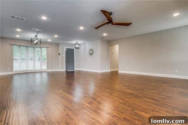 Spacious Living Area with Hardwood Floors and Fireplace