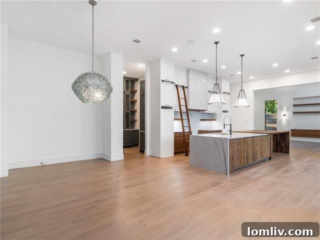 Spacious living area with 10-foot sliding glass doors opening to the veranda and pool area