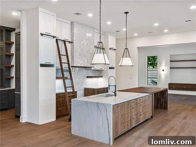 Kitchen island with seating, showcasing modern appliances and open concept design