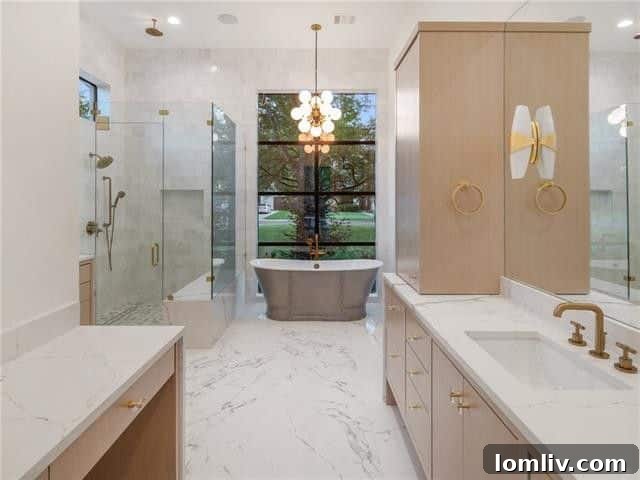 Luxurious master bathroom with a freestanding pewter-finish cast iron tub and large window