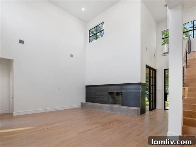 Elegant study with custom steel and glass sliding door and fireplace connection